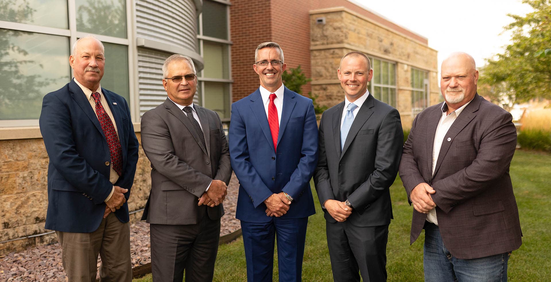 Five farmers in suits meeting in Ankeny, Iowa